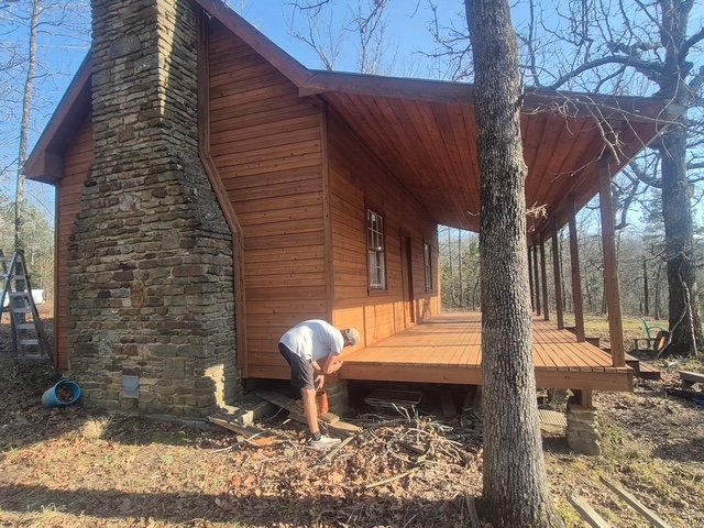 Cabin chimney side, stained and sealed after restoration