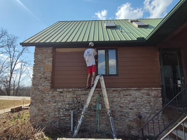 Staining wood siding from a ladder